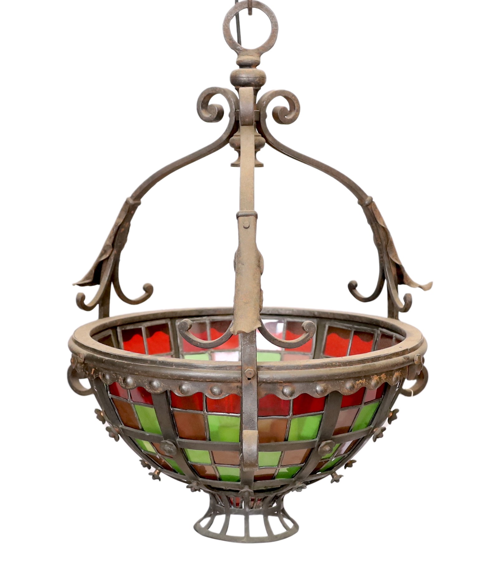 An English Arts & Crafts wrought iron and stained glass basket shaped light fitting, height 70cm to the top of the fitting with additional 10 link heavy wrought iron chain. width 52cm.